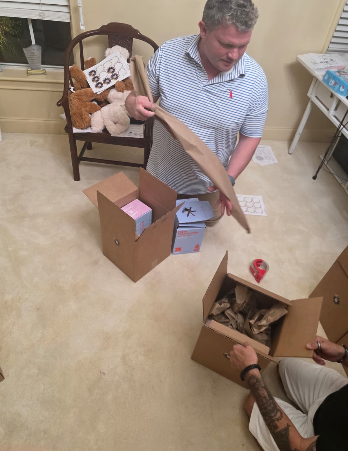 Volunteers packing memory-making kits for McKenzie's Rays of Sunshine